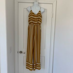 Spaghetti strap flowing wide leg jumpsuit with pockets